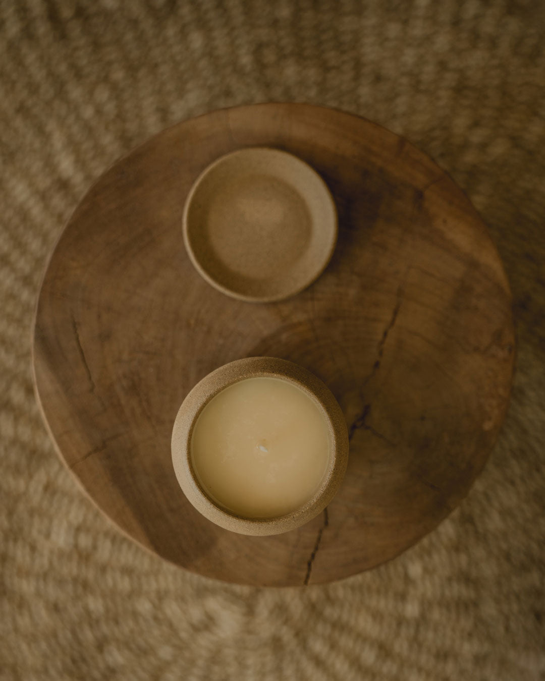 candles on a plate in brown background f zeen boutique